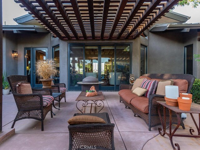 view of patio / terrace featuring an outdoor living space and a pergola