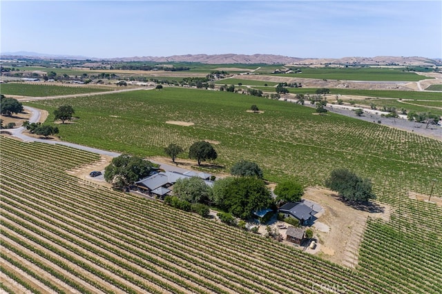 drone / aerial view with a mountain view and a rural view