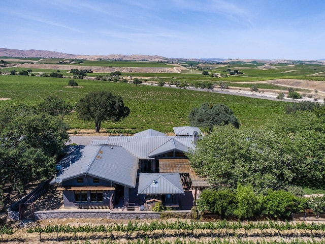 birds eye view of property featuring a mountain view and a rural view