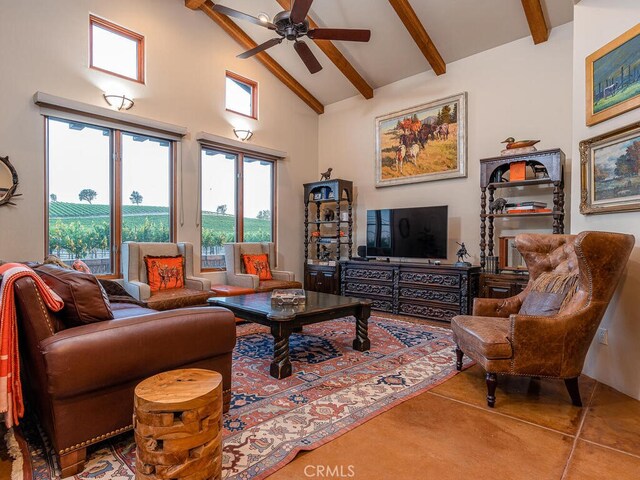 living room featuring ceiling fan, high vaulted ceiling, beamed ceiling, and tile patterned flooring