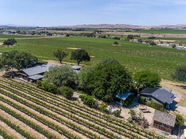 drone / aerial view with a mountain view and a rural view