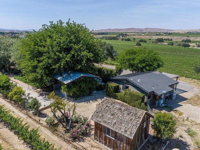 birds eye view of property with a rural view and a mountain view