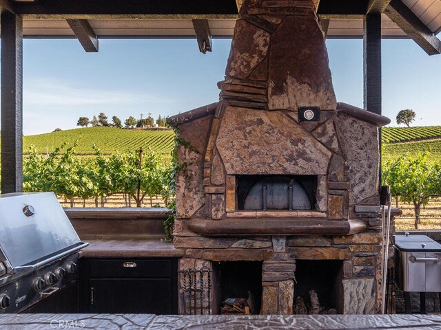 view of patio / terrace featuring a rural view and a grill