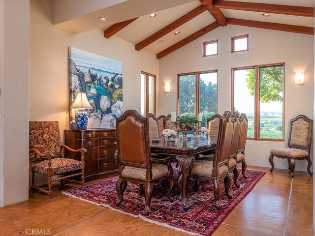 dining room with vaulted ceiling with beams