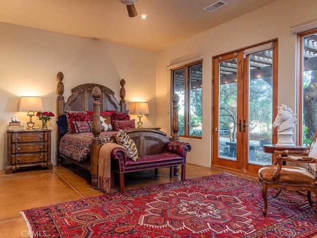 tiled bedroom featuring ceiling fan and access to outside