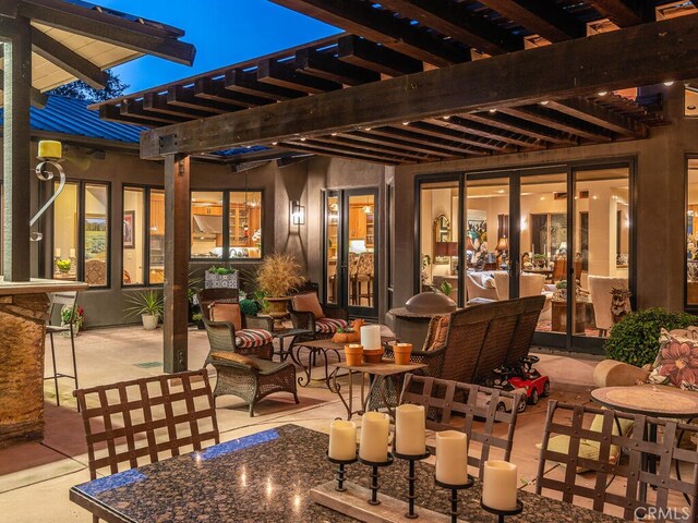 view of patio featuring a pergola and french doors