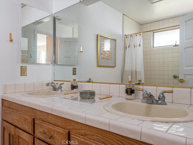 bathroom featuring vanity and a shower with curtain