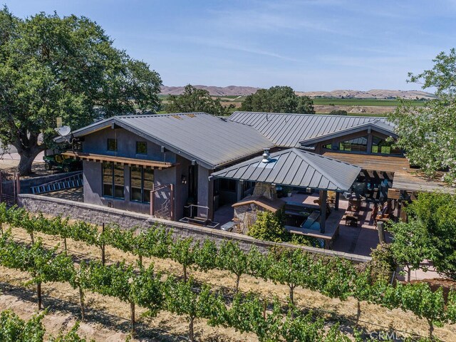 back of property with a mountain view