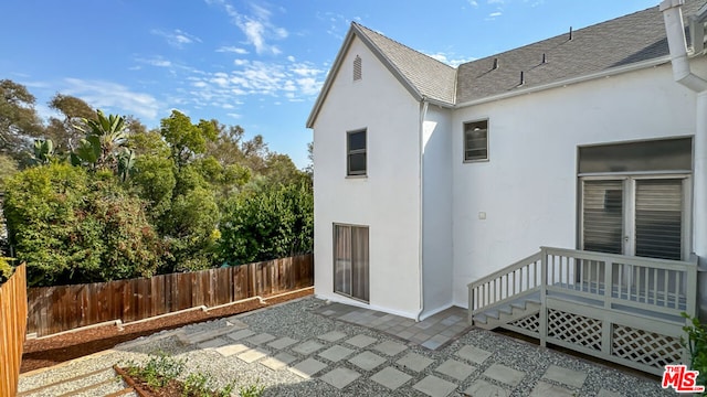 back of property featuring a patio area