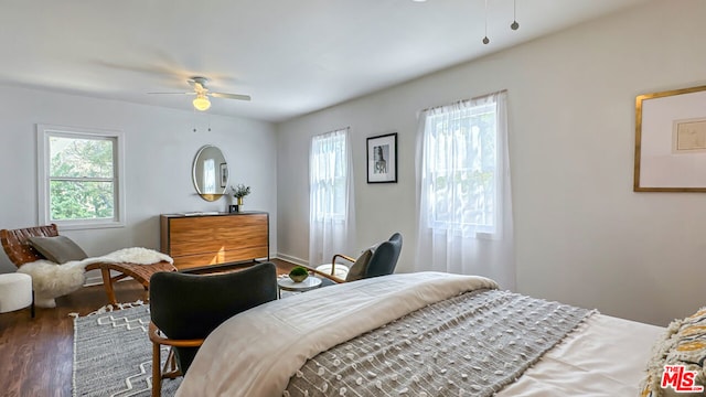 bedroom featuring ceiling fan and dark hardwood / wood-style floors