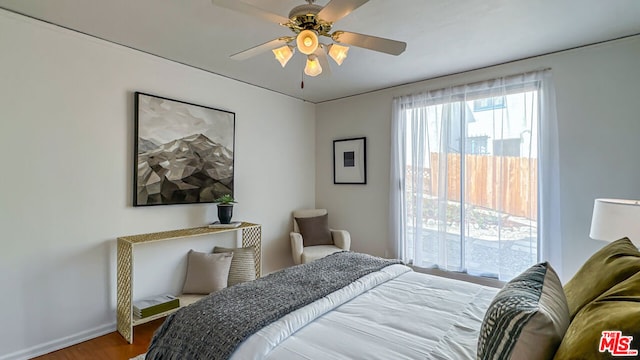 bedroom with ceiling fan and wood-type flooring