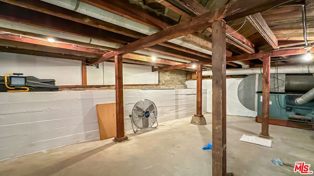 basement featuring heating unit