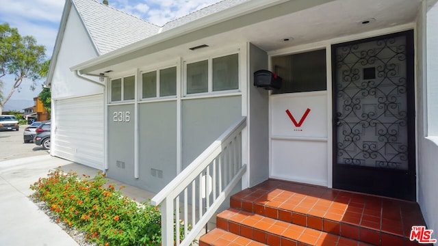 property entrance with a garage