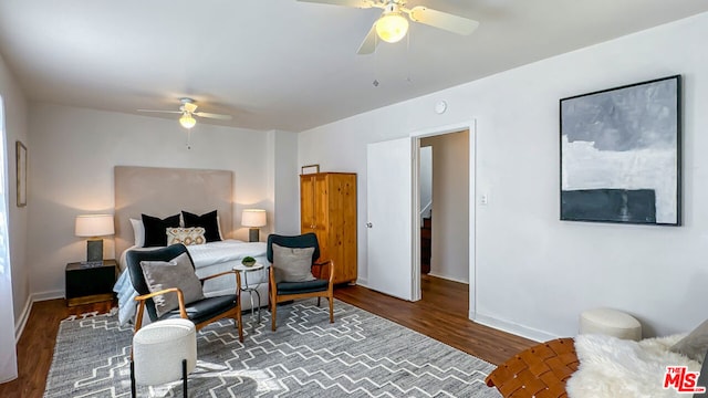 bedroom featuring dark wood-type flooring and ceiling fan