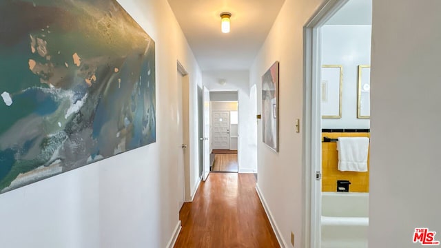 corridor featuring hardwood / wood-style flooring