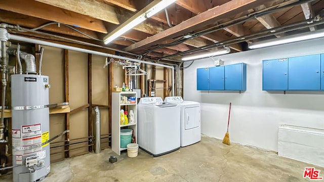 basement featuring washer and dryer and strapped water heater