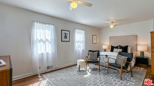 bedroom featuring wood-type flooring and ceiling fan