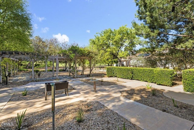 view of home's community featuring a pergola