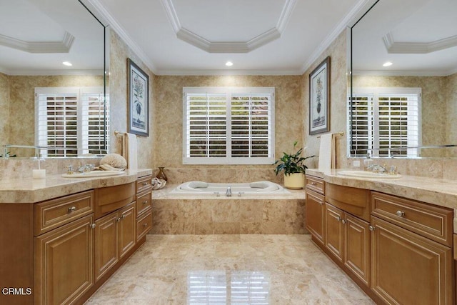 bathroom featuring a raised ceiling, crown molding, tiled tub, and vanity