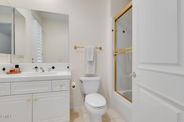 full bathroom with vanity, toilet, shower / bath combination with glass door, and tile patterned floors