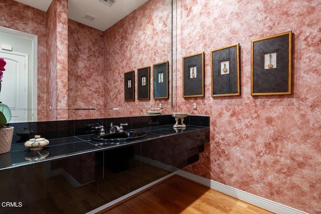 bathroom featuring vanity and hardwood / wood-style floors