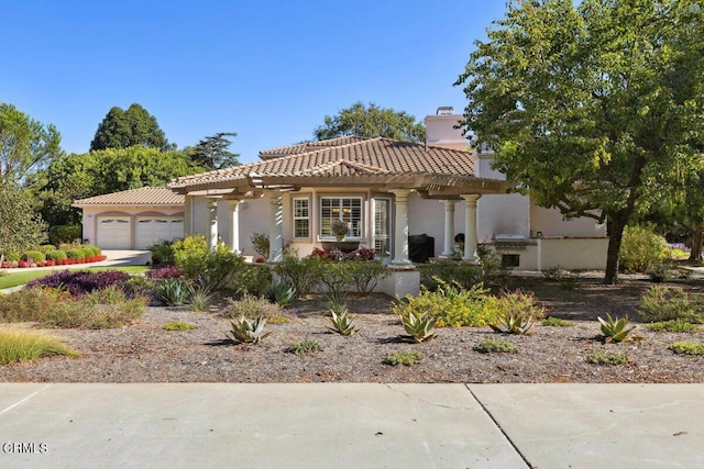 mediterranean / spanish house featuring a garage