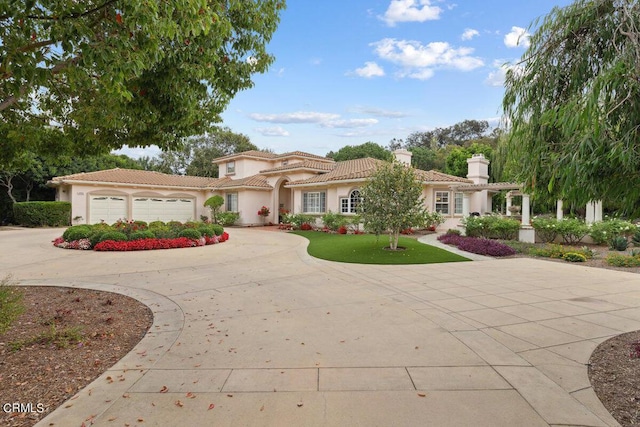 mediterranean / spanish-style home featuring a garage