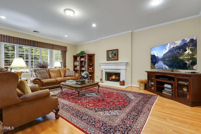 living room with crown molding and wood-type flooring