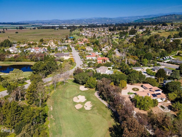 drone / aerial view with a water and mountain view