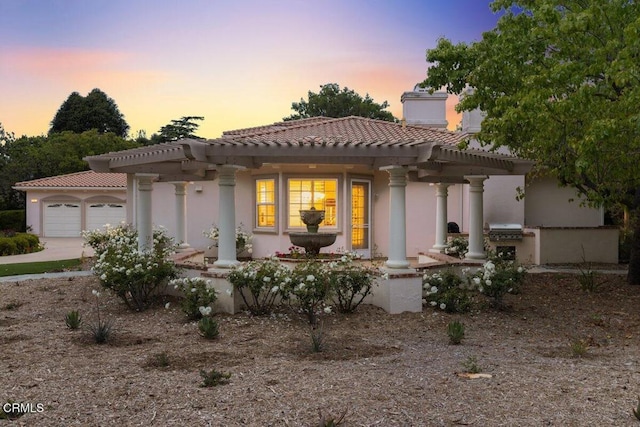 view of front of property with a garage