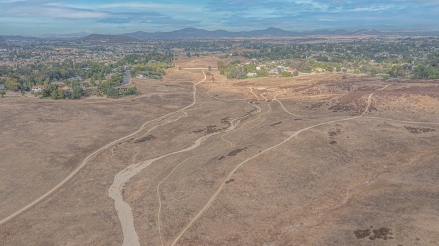 birds eye view of property featuring a mountain view