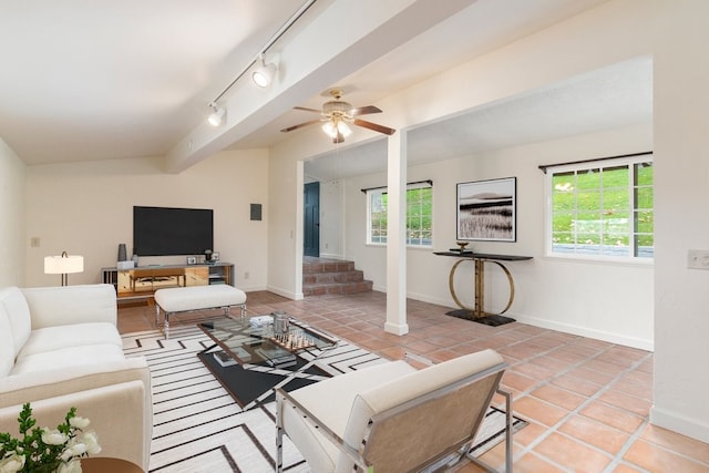 living room with ceiling fan, rail lighting, and light tile patterned floors