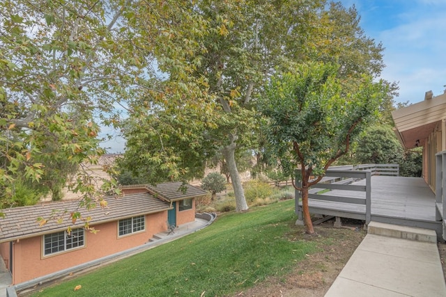 view of yard with a deck