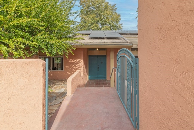 property entrance featuring solar panels