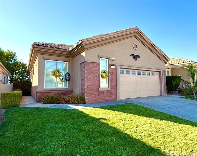 mediterranean / spanish-style home featuring a front yard and a garage