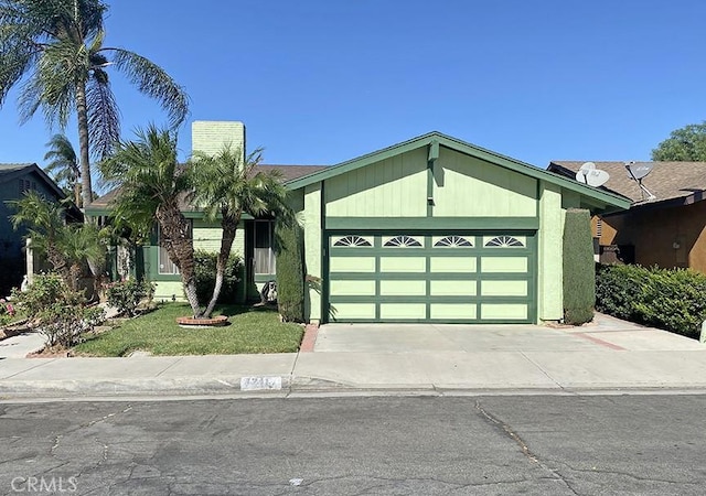 single story home with a garage