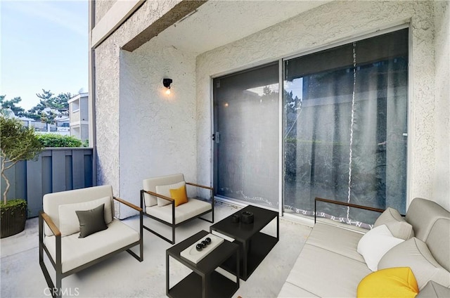 view of patio with a balcony and an outdoor hangout area