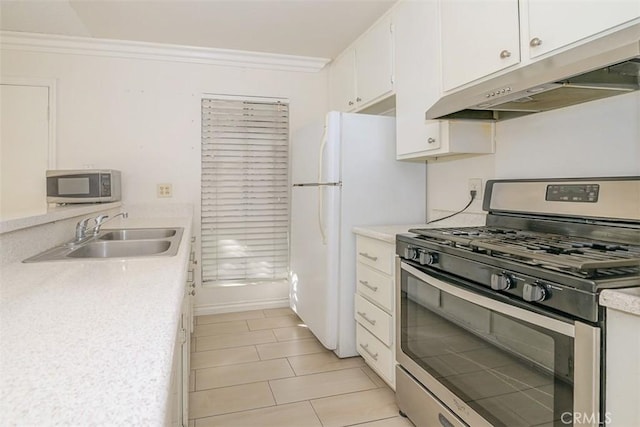 kitchen with sink, crown molding, white cabinetry, stainless steel appliances, and light tile patterned floors