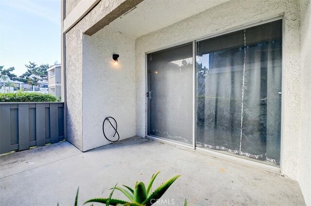 doorway to property with a balcony