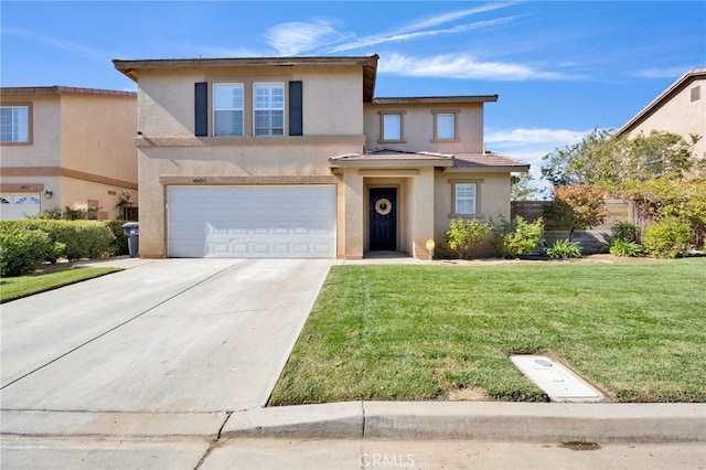 view of front of home with a garage and a front lawn