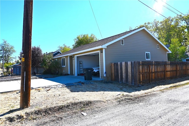 view of side of home with a garage