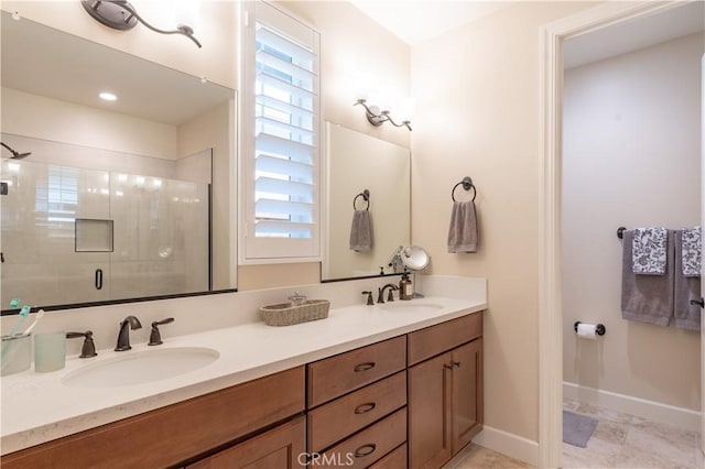 bathroom featuring vanity and a shower with shower door