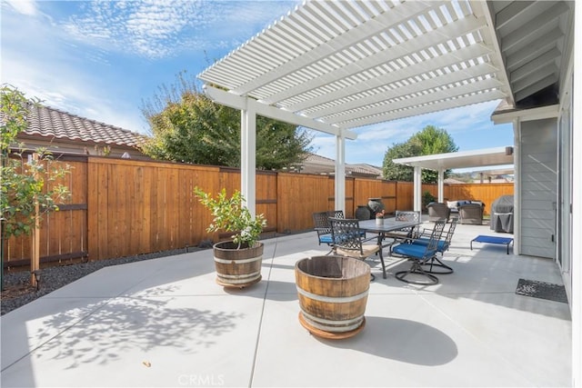 view of patio featuring a grill and a pergola