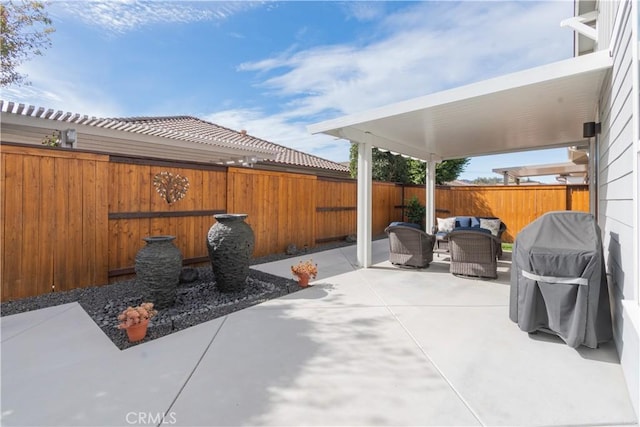 view of patio with outdoor lounge area and area for grilling