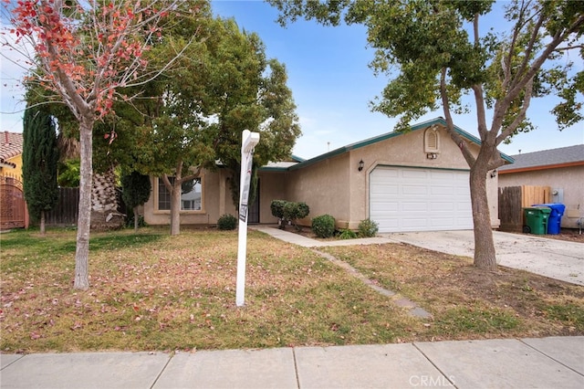 view of front of home with a garage and a front lawn