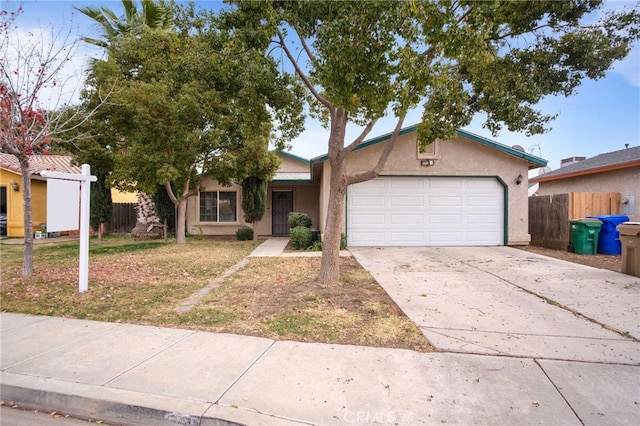 view of front of home featuring a front lawn and a garage