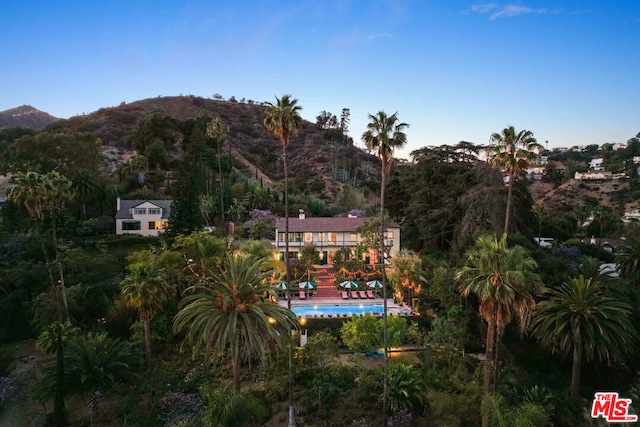 birds eye view of property with a mountain view