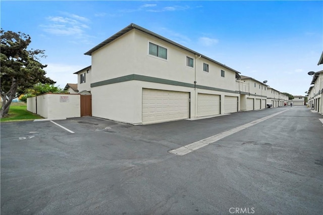 view of side of home with a garage