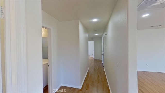 corridor featuring light hardwood / wood-style flooring