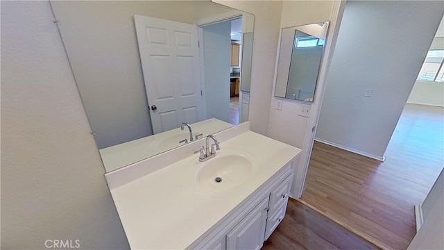 bathroom with vanity and wood-type flooring